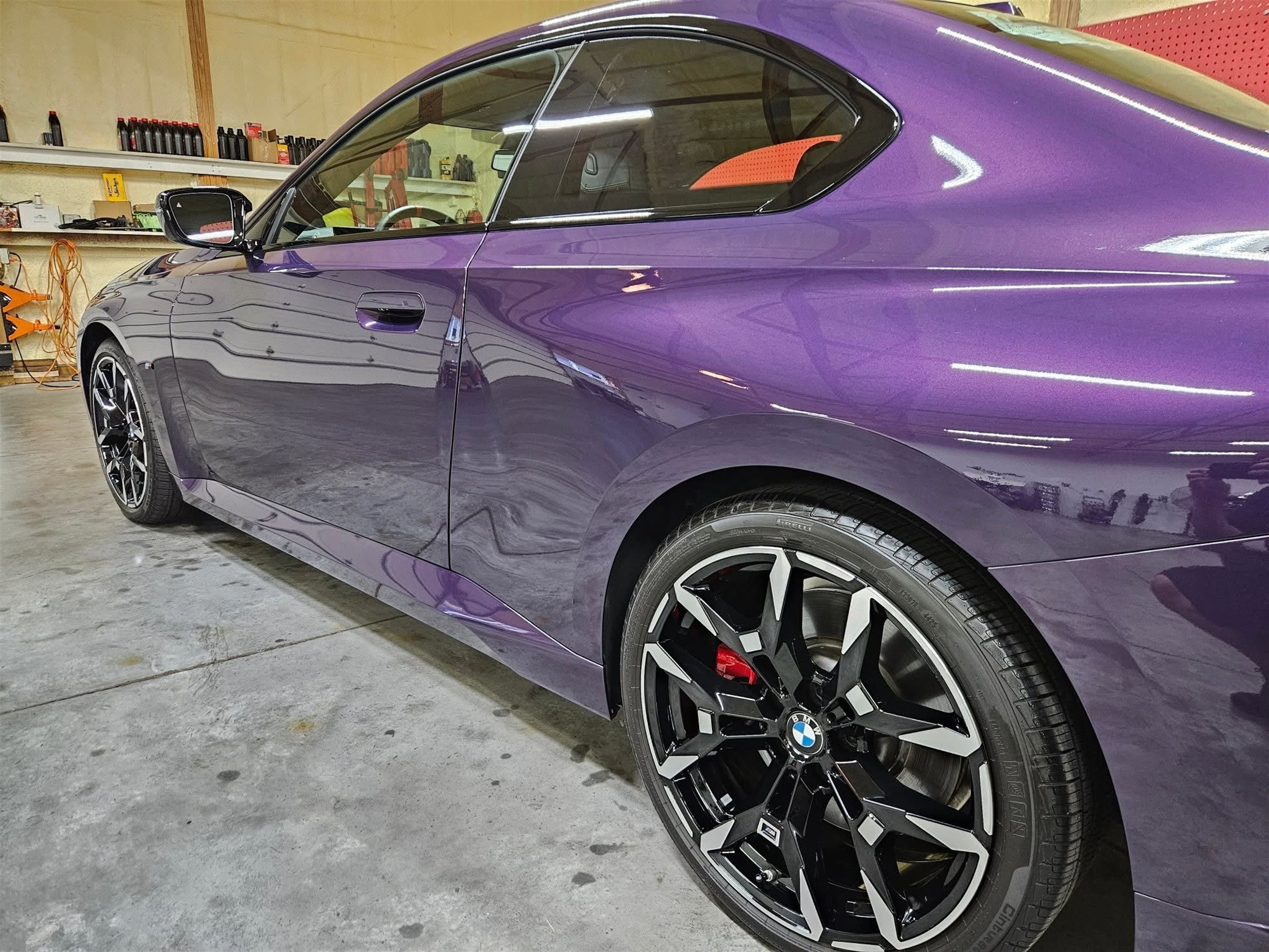 Purple BMW side profile with deep gloss reflection